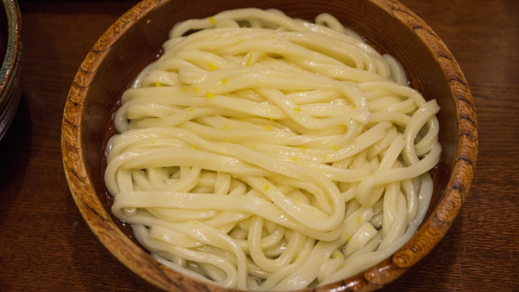 Yuzu citrus peel is lightly grated over fresh udon (wheat) noodles at Omen Restaurant, Kyoto, Japan | cultivatorkitchen.com